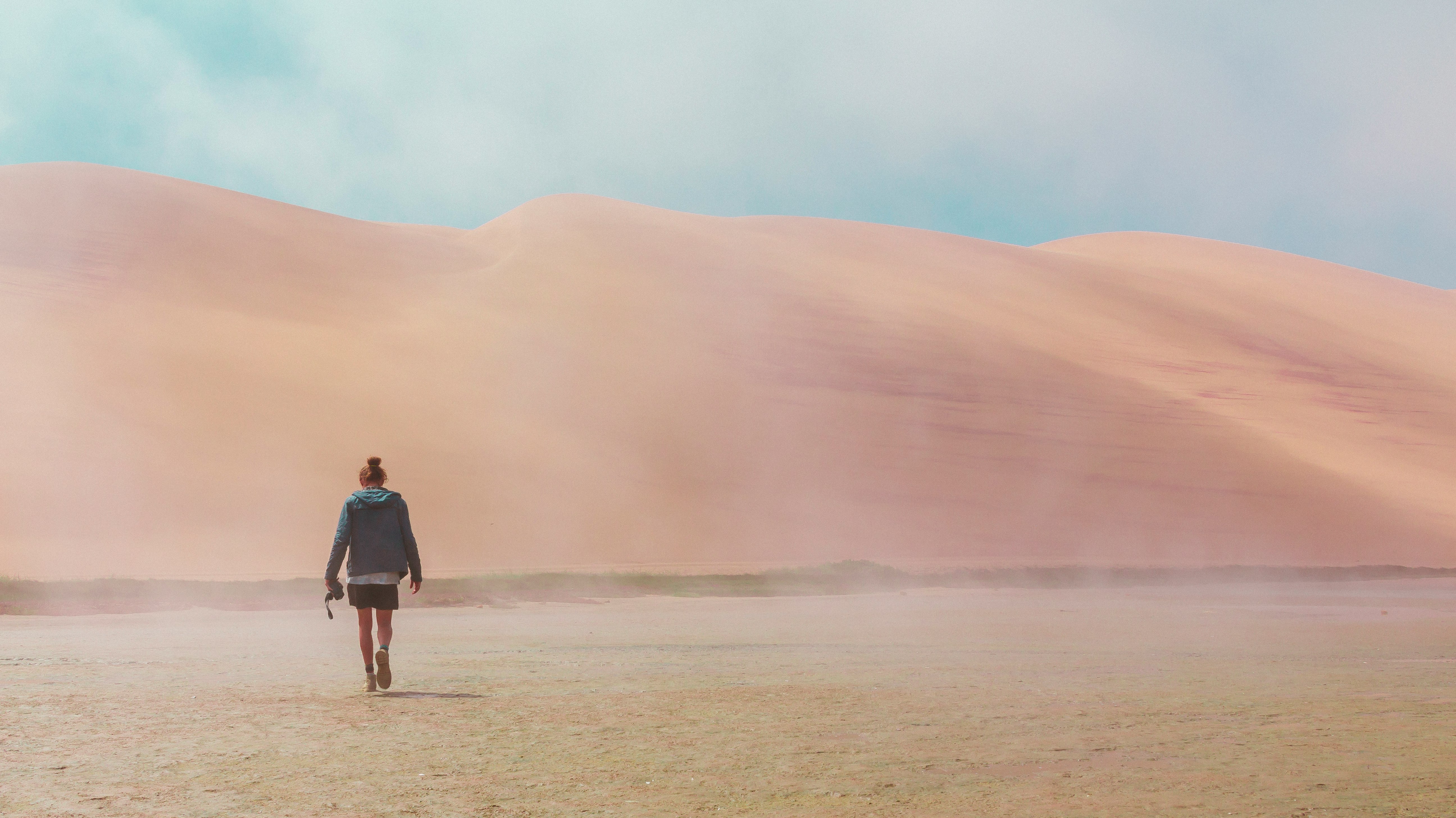 woman walking on desert